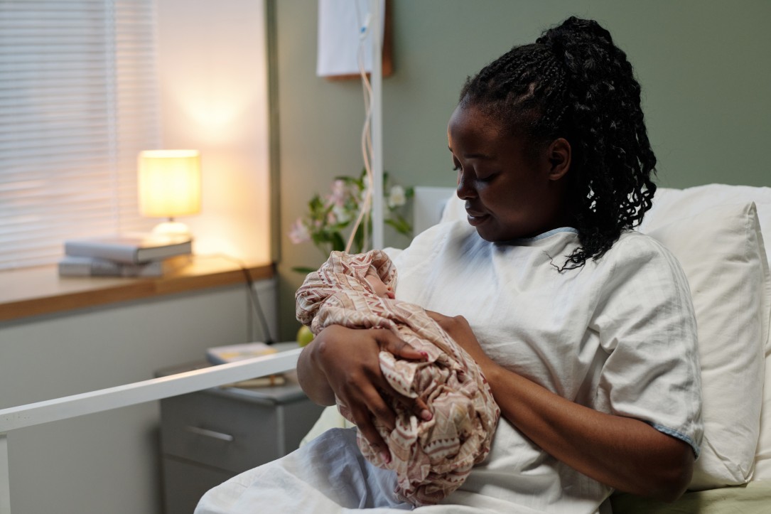 Black mother holding an infant